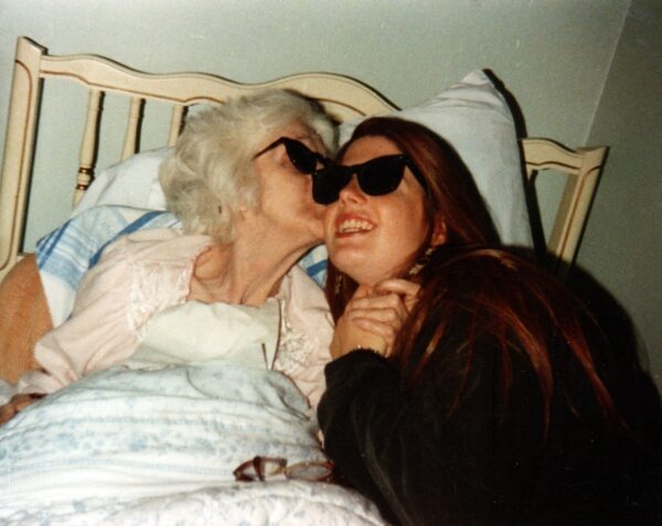 grandmother and granddaughter wearing sunglasses